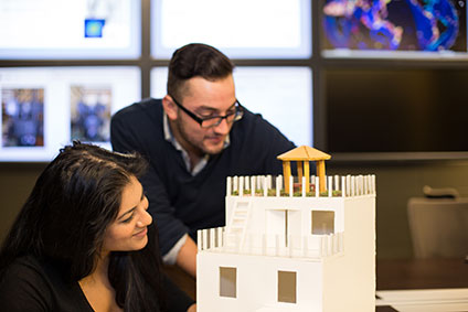 Two students build a project together