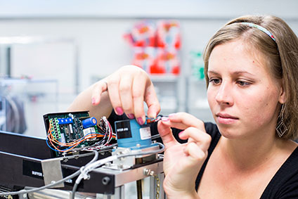 A student connects circuit boards