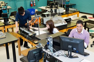 Three students in a classroom