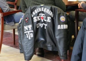 A Skule jacket rests on a chair.