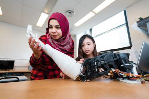 Students pose with robotics.
